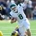 Eastern Michigan quarterback Alex Gillett gets tangled up by Michigan junior defensive end Craig Roh during the second half at Michigan Stadium on Saturday. Melanie Maxwell I AnnArbor.com